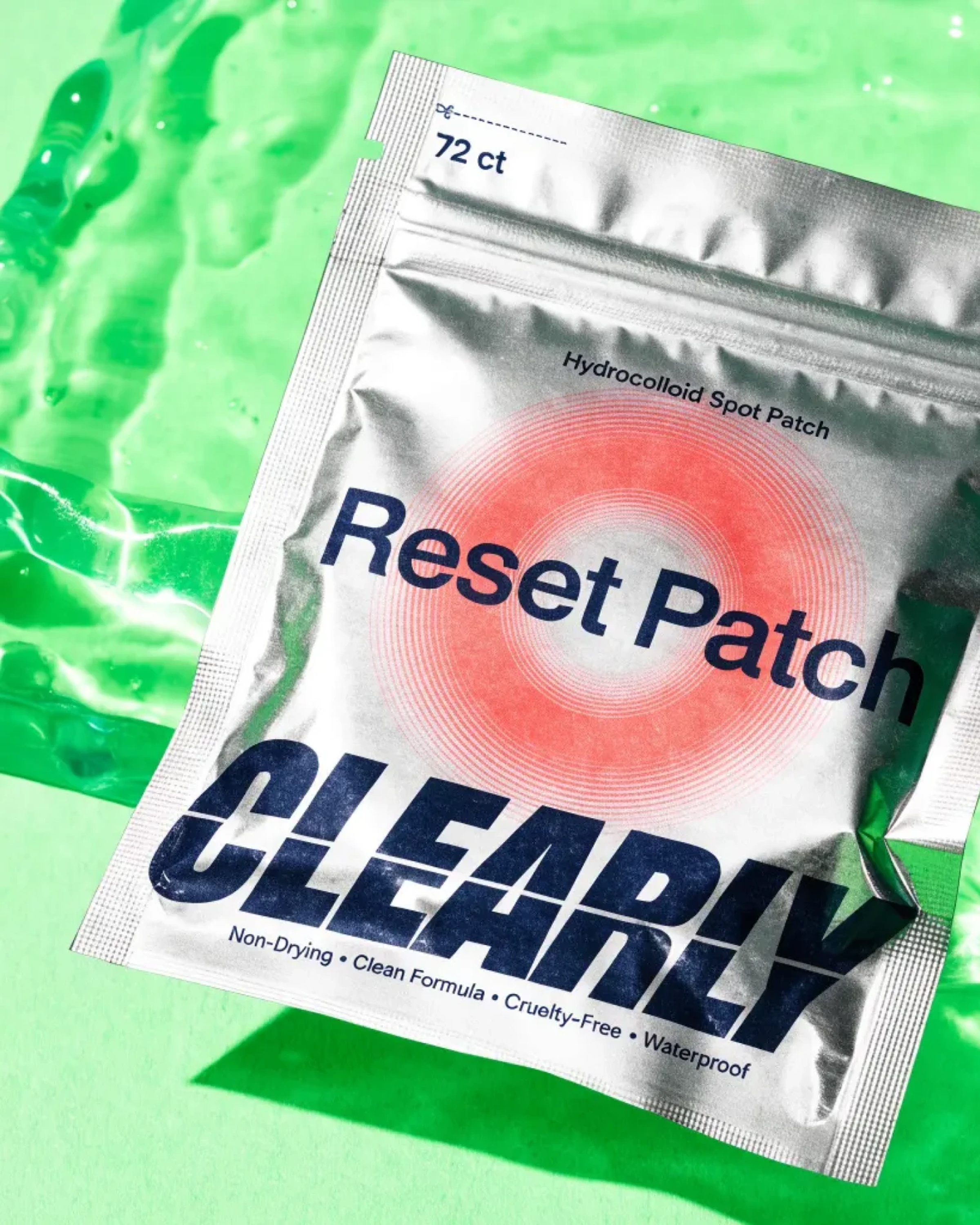Clearly, a Reset Patch pouch against a mint background