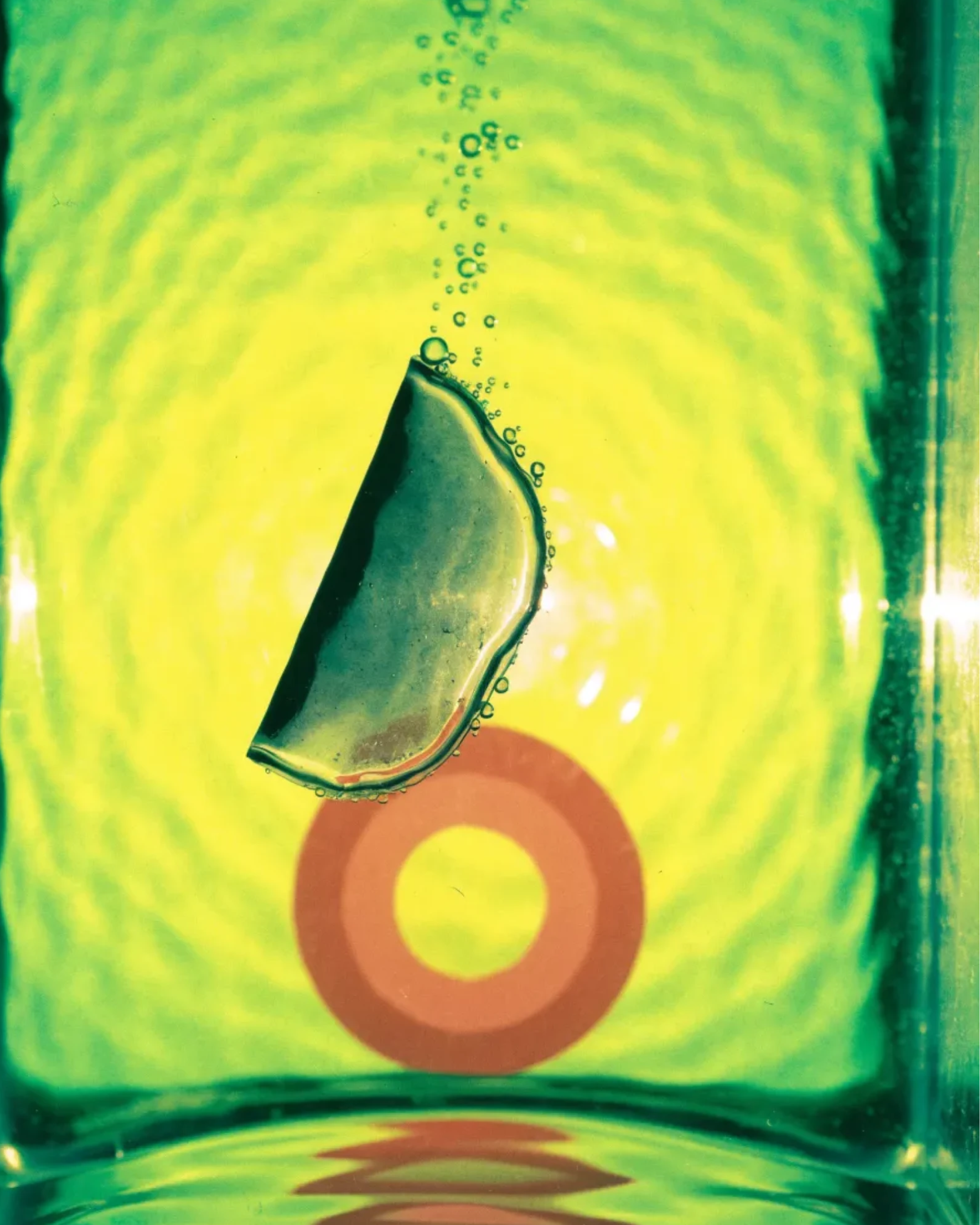 Clearly, a patch sinking through lime water