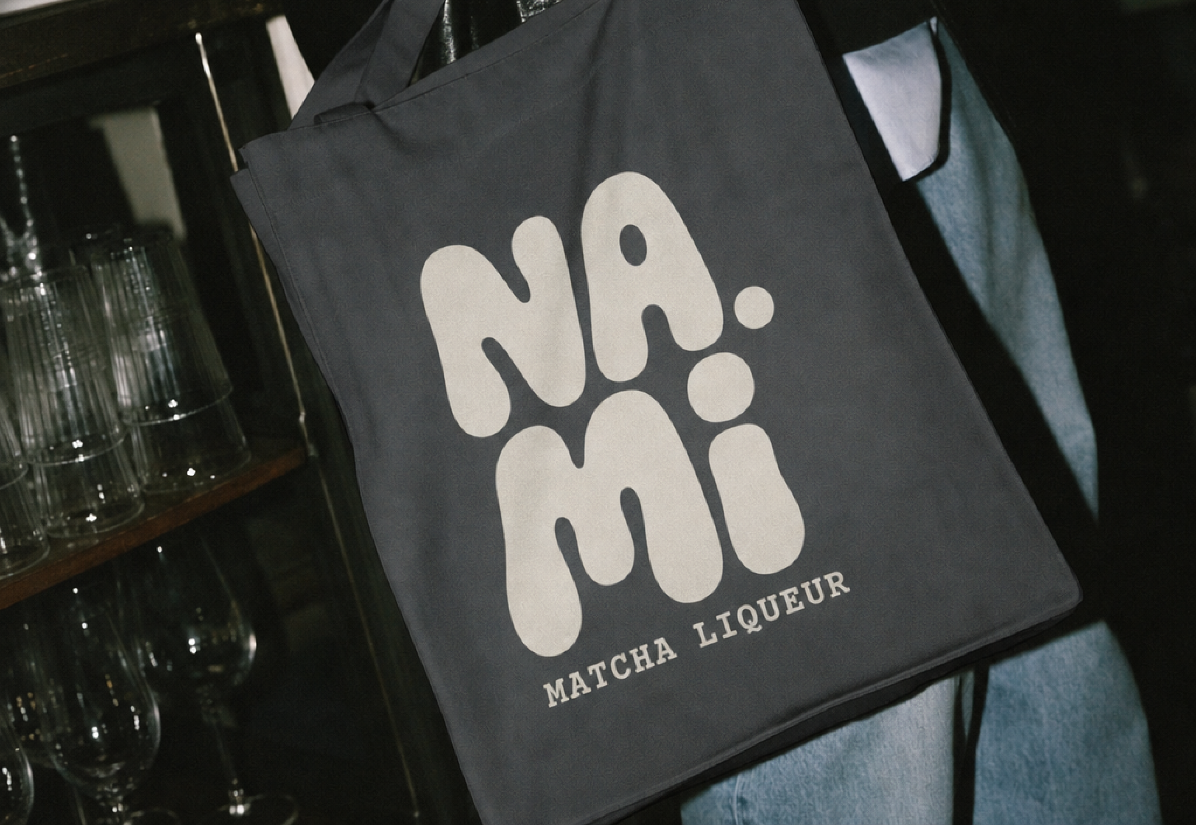 NAMI, a black tote bag with the NAMI logo