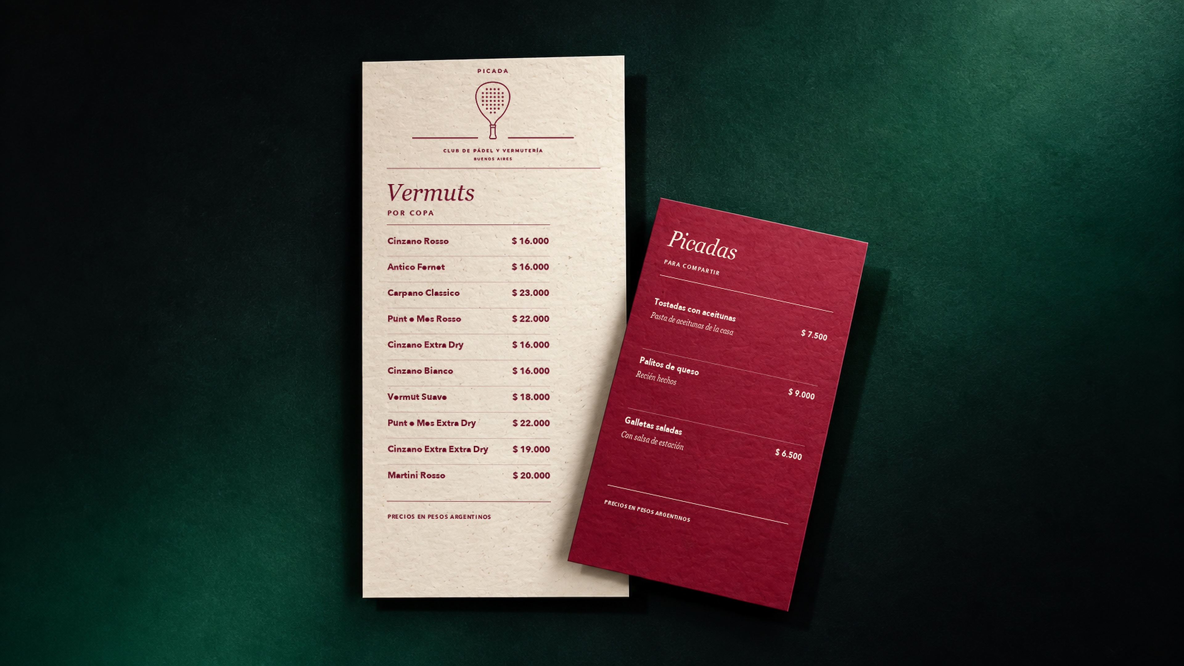 Picada, vermouth and picadas menus on a dark green felt table